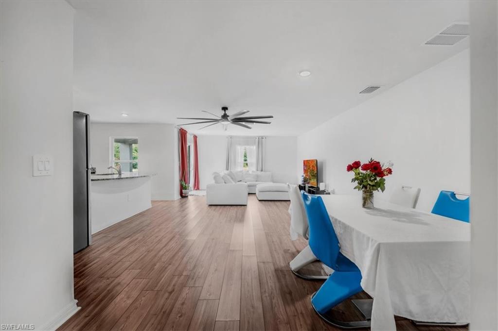Dining area featuring wood finished floors, recessed lighting, and a ceiling fan