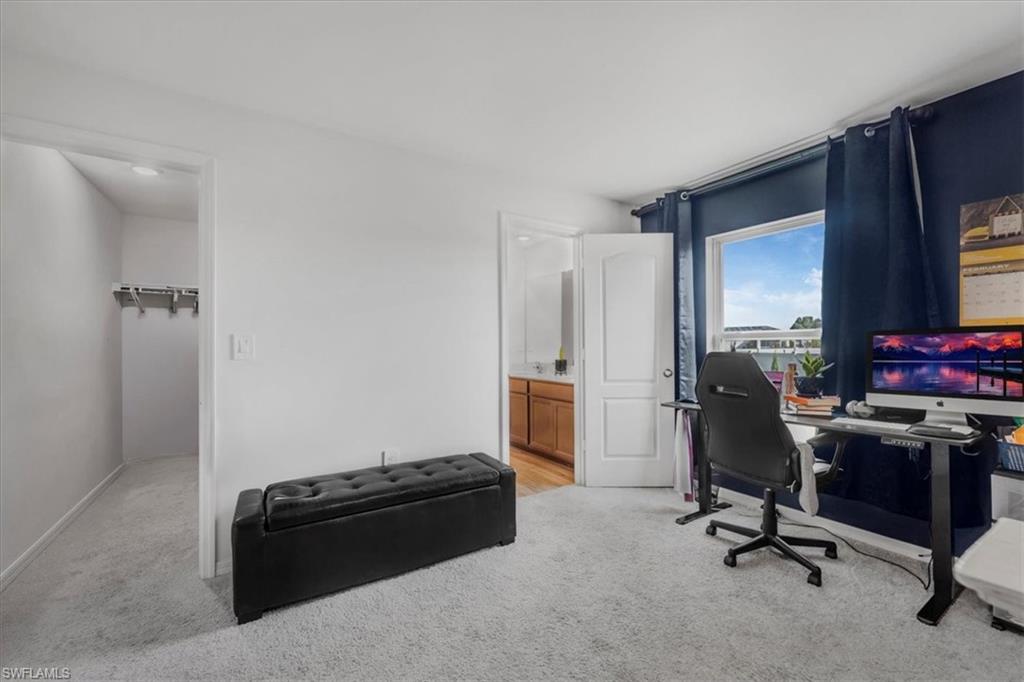 Office featuring light carpet