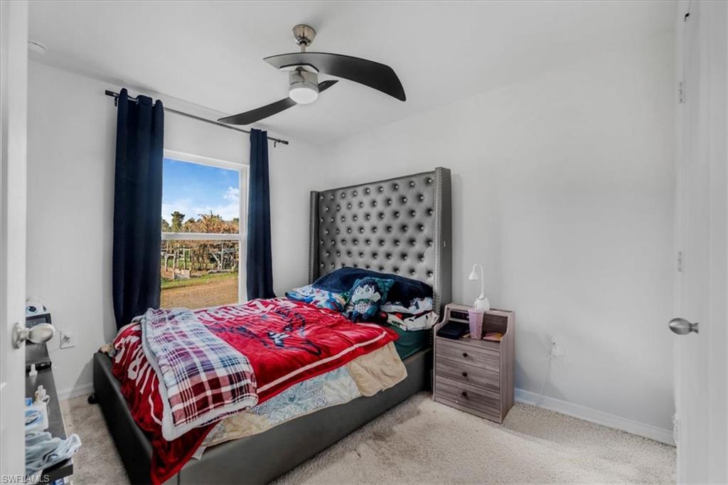 Bedroom with carpet floors and ceiling fan