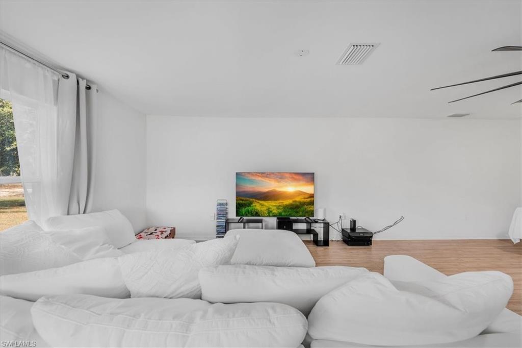 Bedroom with wood finished floors