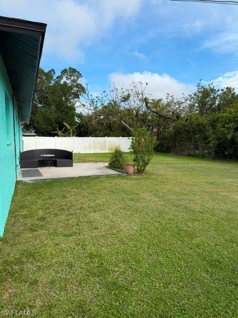 Fenced backyard featuring a patio area