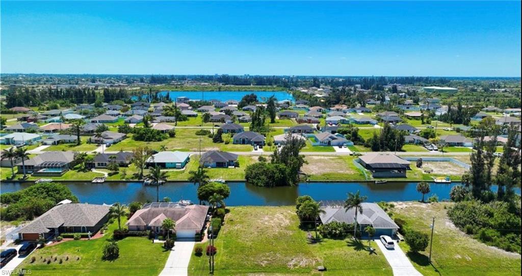 Aerial view of residential area with a large body of water