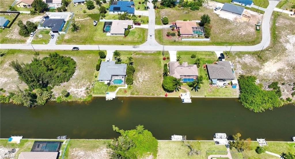 Aerial view of residential area with a nearby body of water