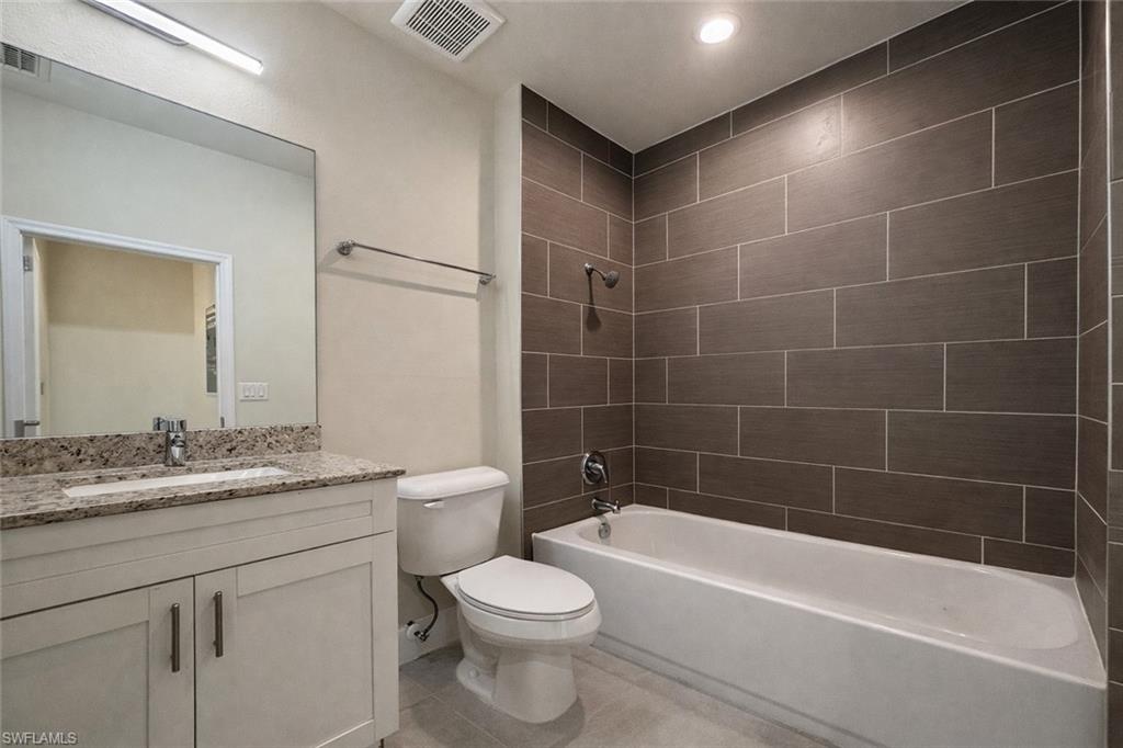 Unfurnished room featuring baseboards and light tile patterned floors