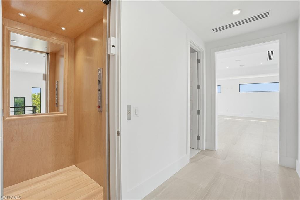 Custom Private Elevator with Wood and Mirror Finish