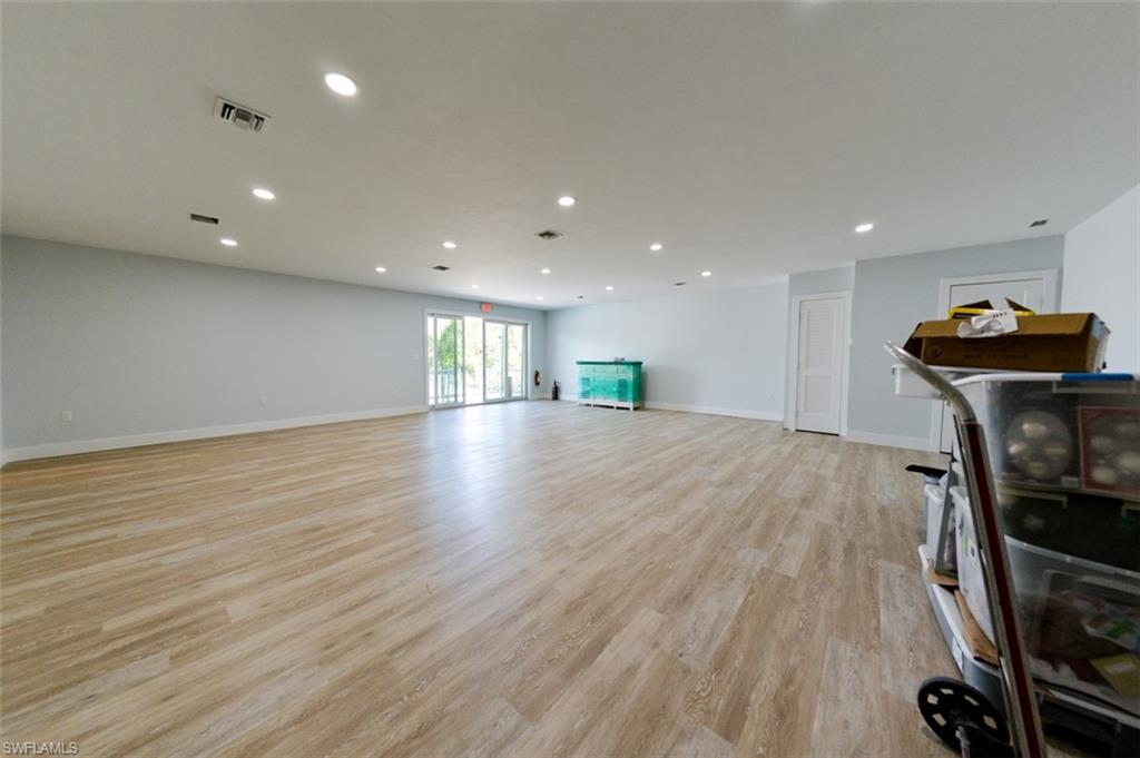 Living room featuring recessed lighting and light wood-style flooring