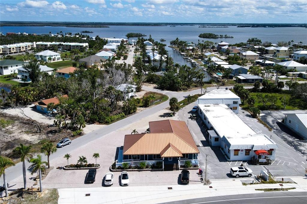 Aerial view of residential area featuring a large body of water