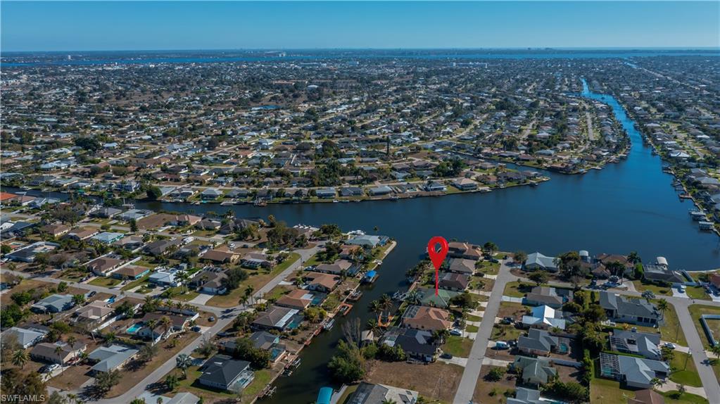 View of property location featuring nearby suburban area and a nearby body of water