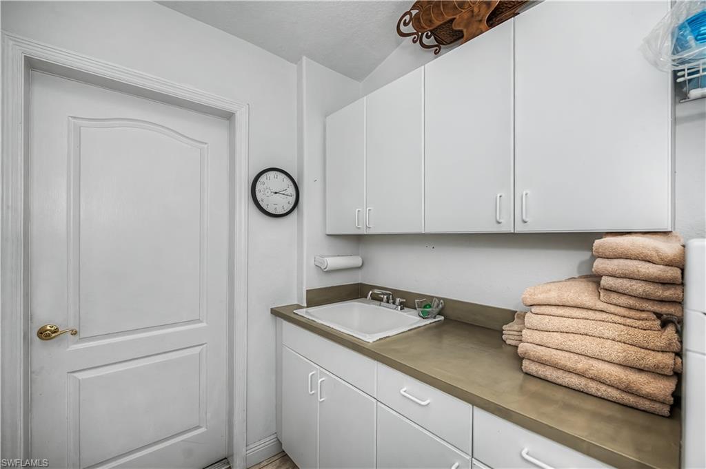 Kitchen with white cabinets and a sink