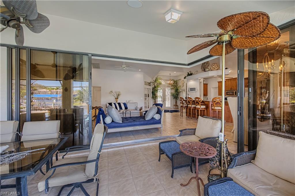 View of patio with ceiling fan and outdoor lounge area