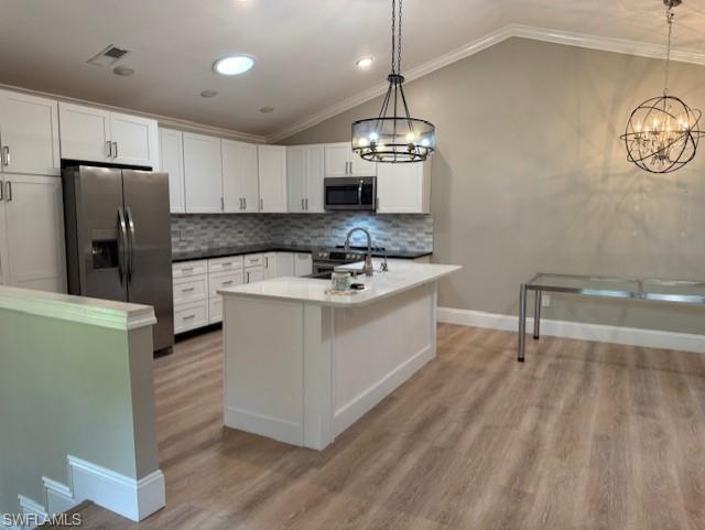 Kitchen Showing dining area and  Designer lighting