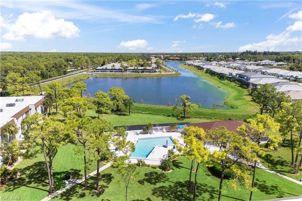Breathtaking aerial view capturing the entire Bonita Pines community nestled alongside the expansive long lake, showcasing serene natural beauty and well-maintained grounds.