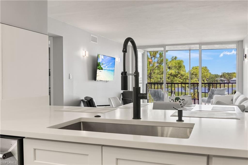 Every detail is new in this kitchen—from the sink and faucets to the cabinetry—offering a fresh, bright space with serene lake views.