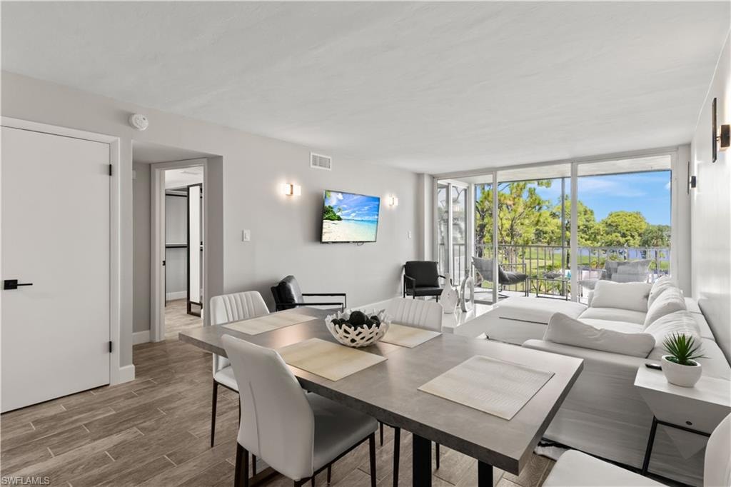 Tastefully furnished dining area filled with light, designed for comfort and casual entertaining.
