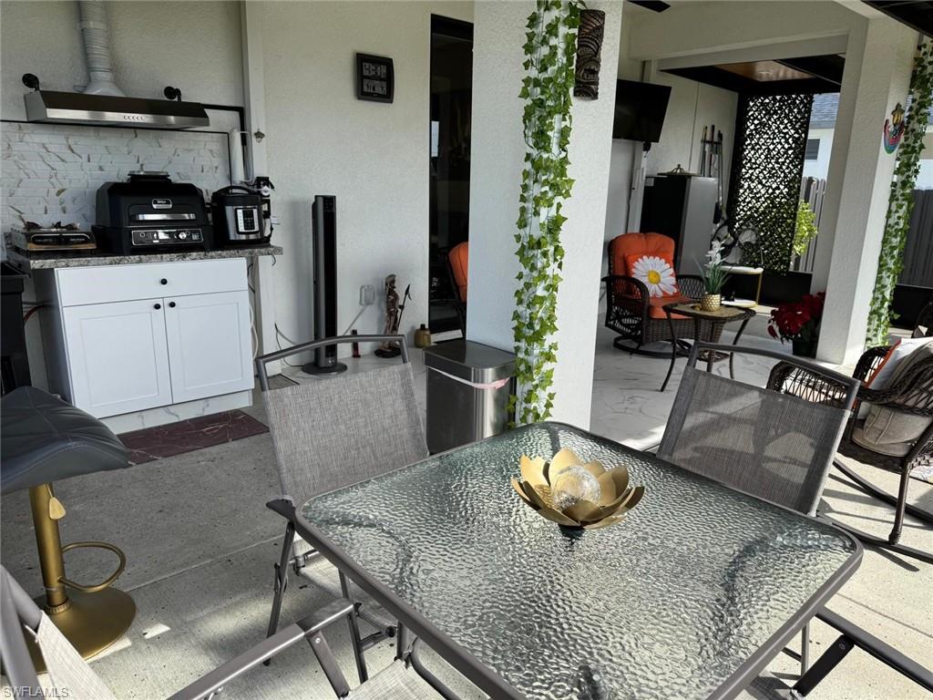View of patio featuring outdoor dining area