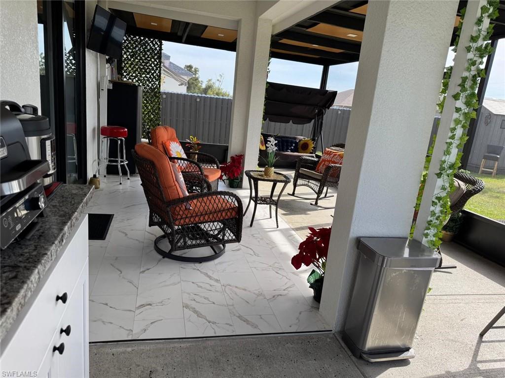View of patio / terrace featuring fence