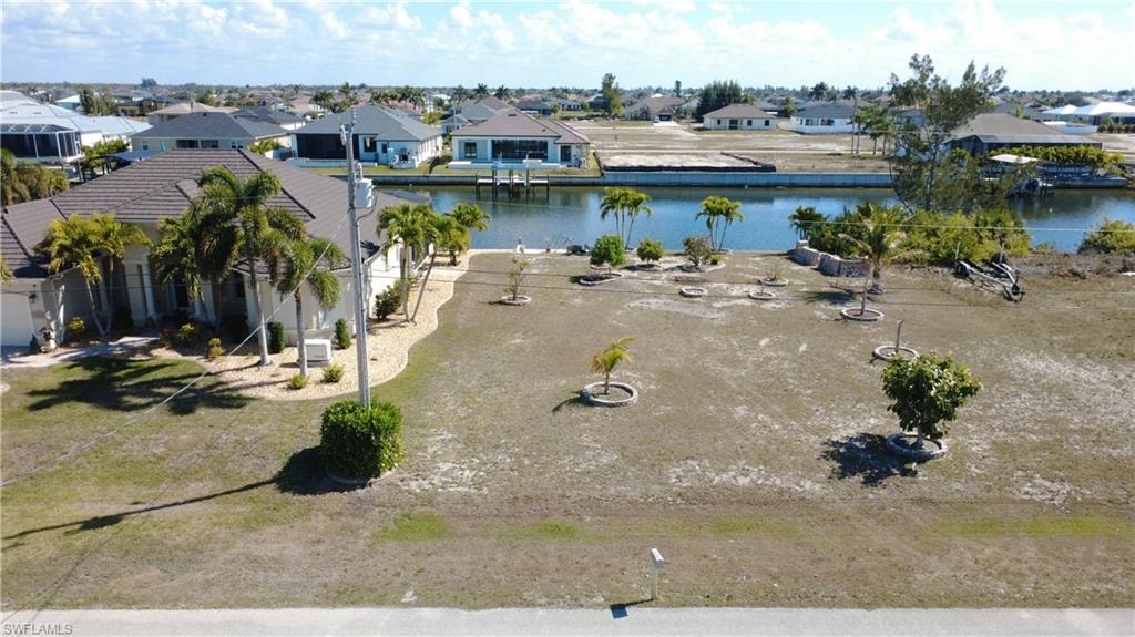 Aerial perspective of suburban area with a nearby body of water