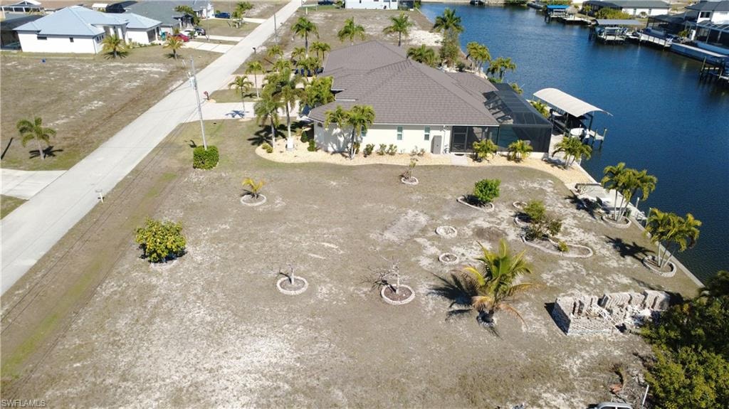 Aerial view of residential area featuring a large body of water