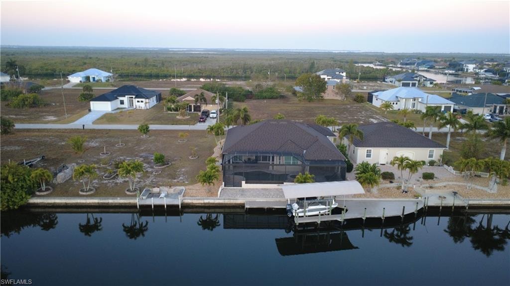 Aerial view at dusk of a residential view and a water view