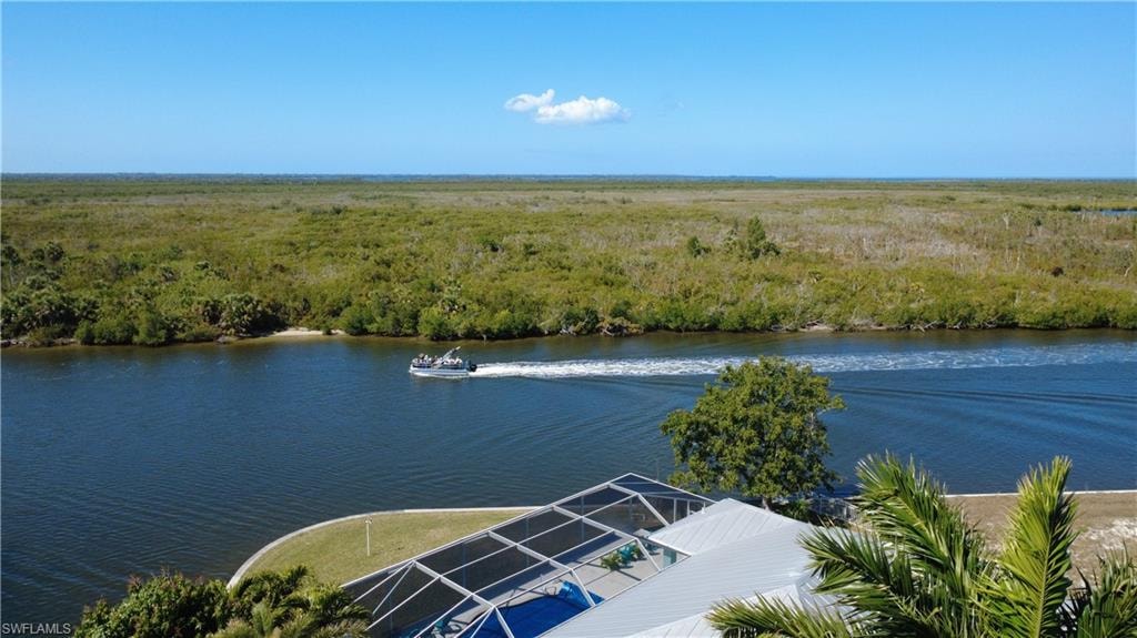 Water view featuring a heavily wooded area