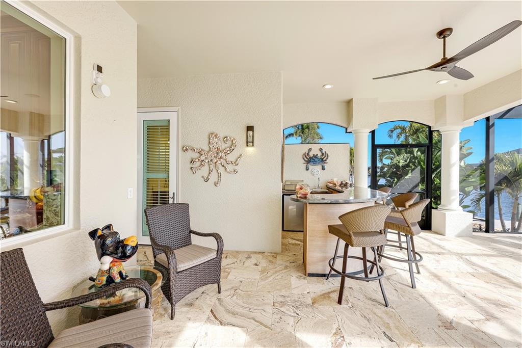 View of patio featuring ceiling fan