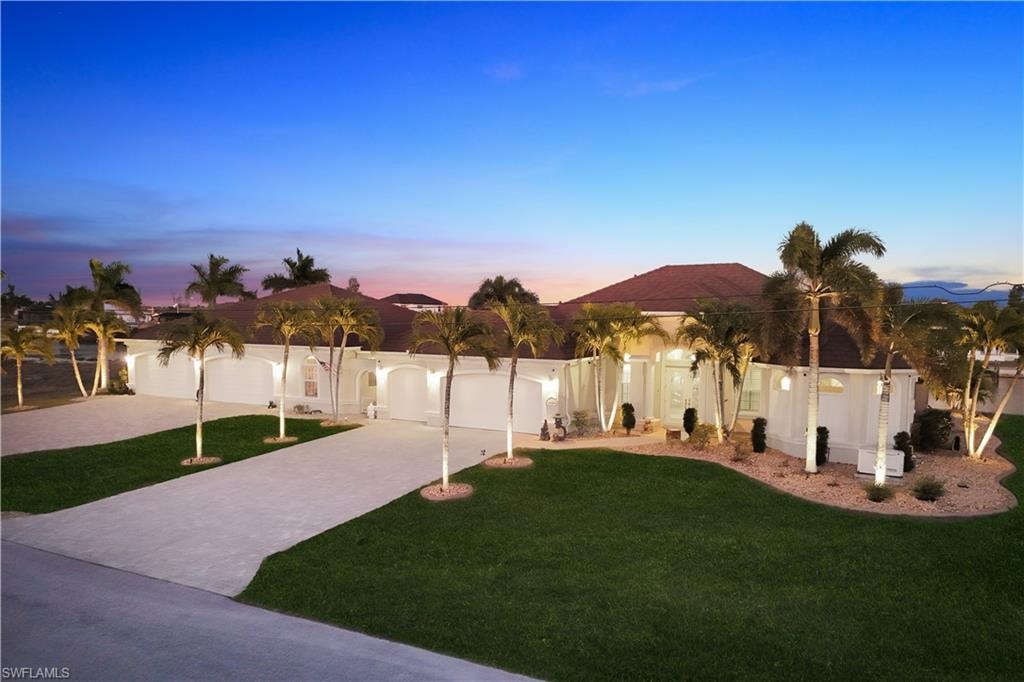 Integrated pool / spa featuring a sunroom, glass enclosure, a patio, and a water view