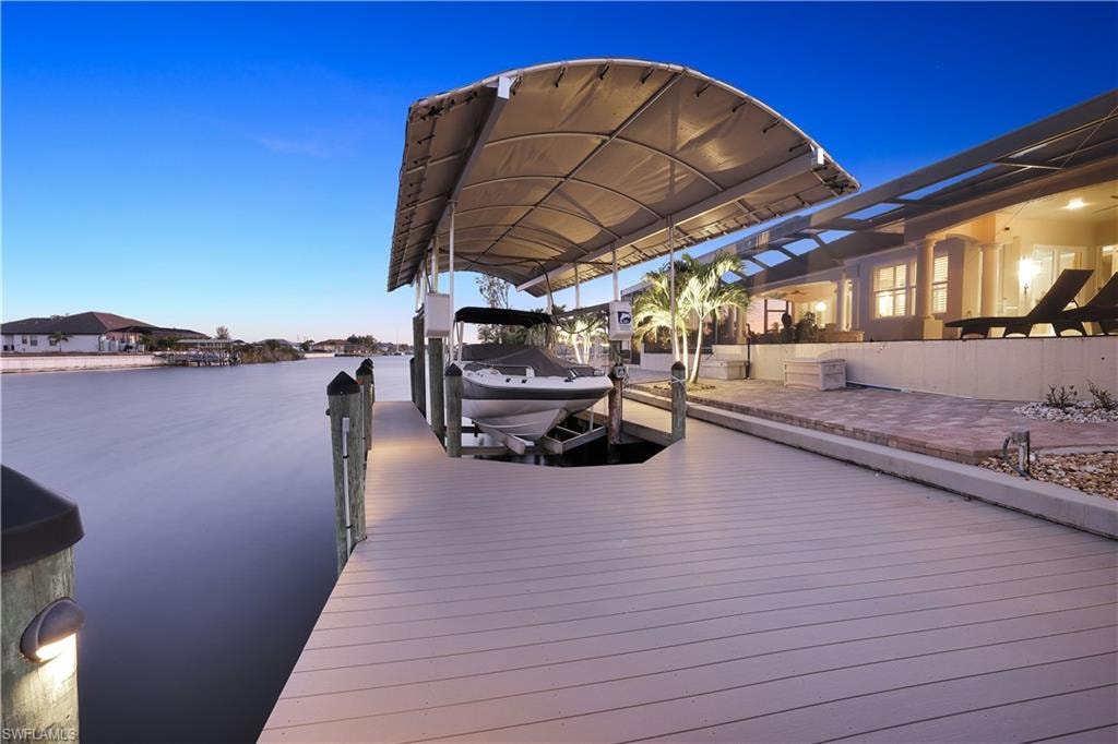 Dock with boat lift and a water view