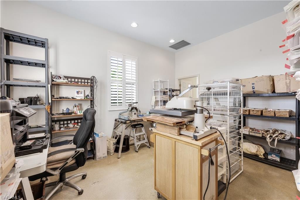 Home office featuring concrete flooring and recessed lighting