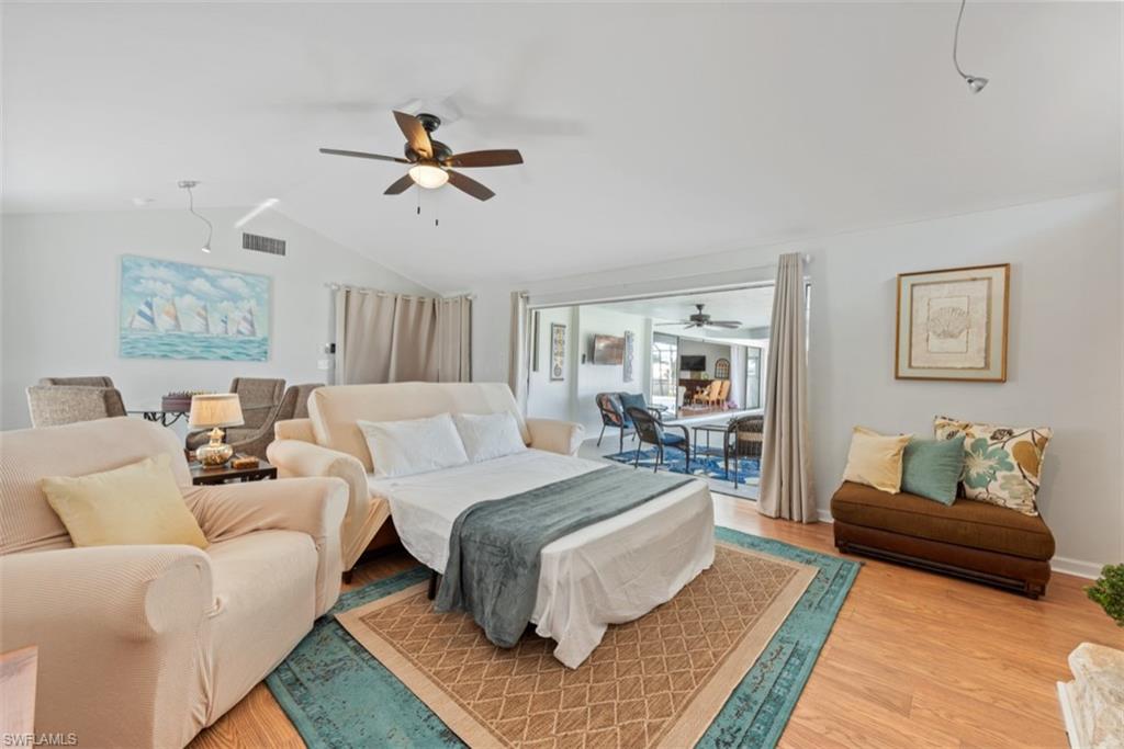 Bedroom with light wood-style floors and ceiling fan