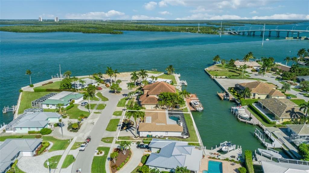 Aerial view of residential area featuring a large body of water