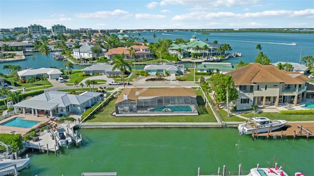 Aerial perspective of suburban area with a large body of water
