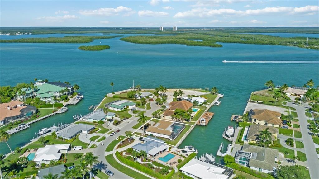 Aerial perspective of suburban area with a nearby body of water
