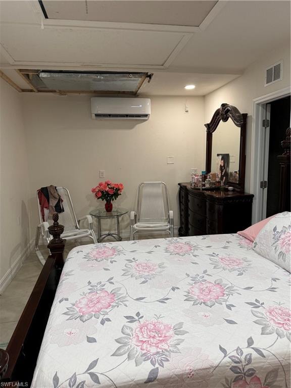 Bedroom featuring baseboards and an AC wall unit