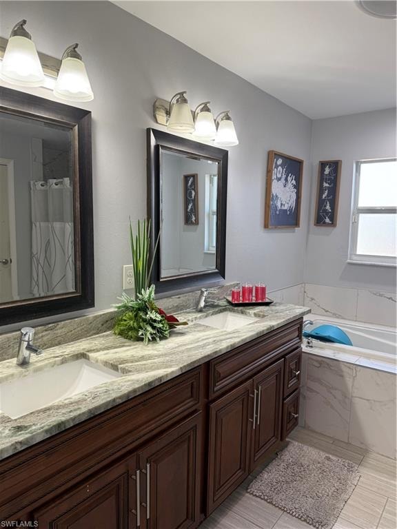 Full bath with double vanity, curtained shower, and a garden tub