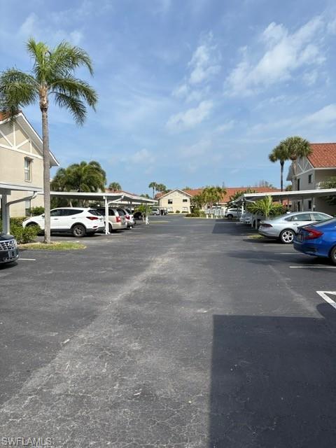 Partially covered parking lot with a residential view