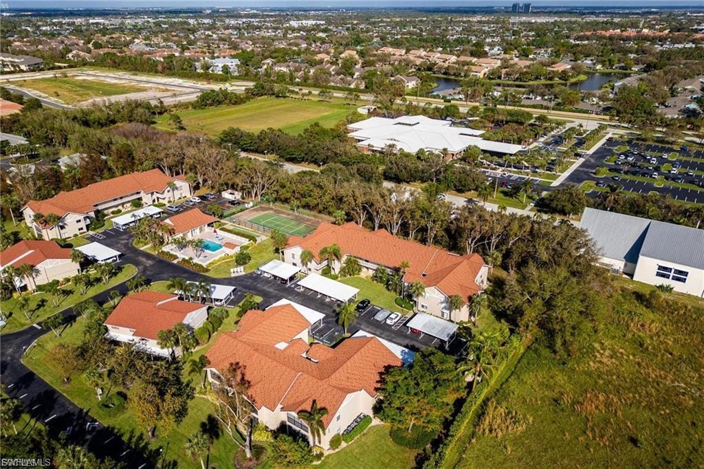 Aerial overview of property's location with a large body of water and nearby suburban area