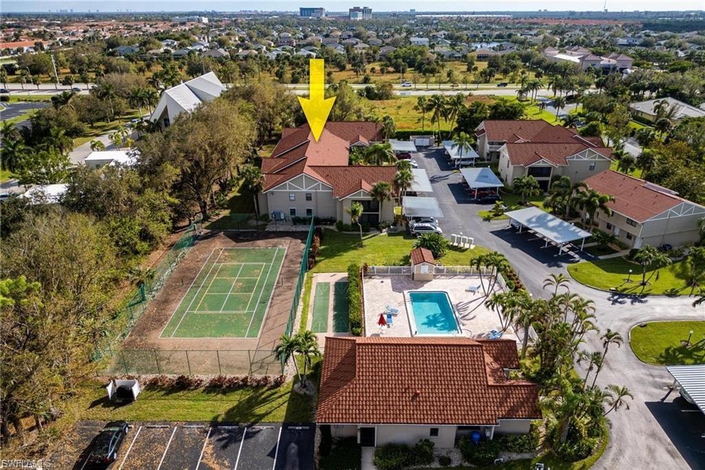 Aerial view of residential area featuring a pool area
