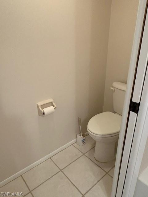 Bathroom featuring baseboards and tile patterned flooring