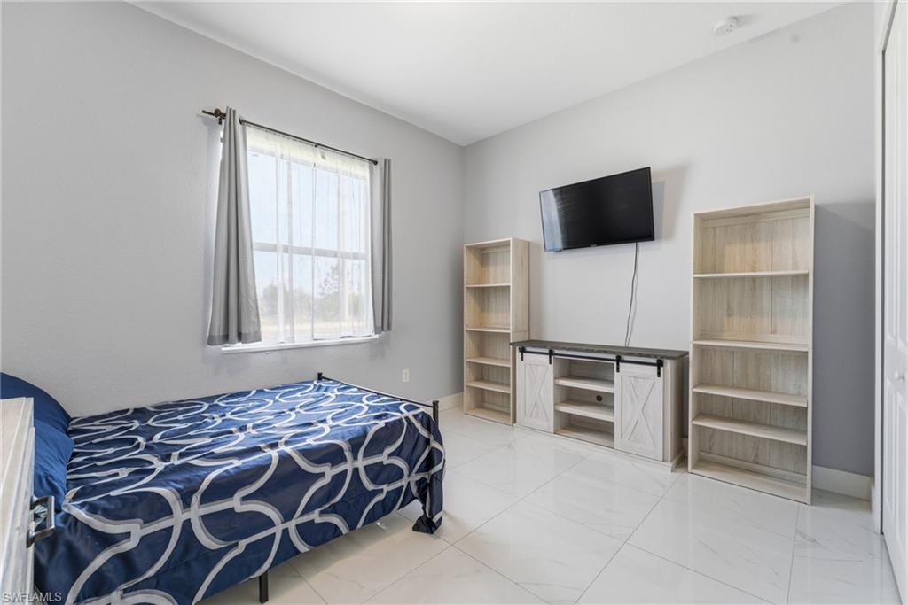 Bedroom featuring baseboards