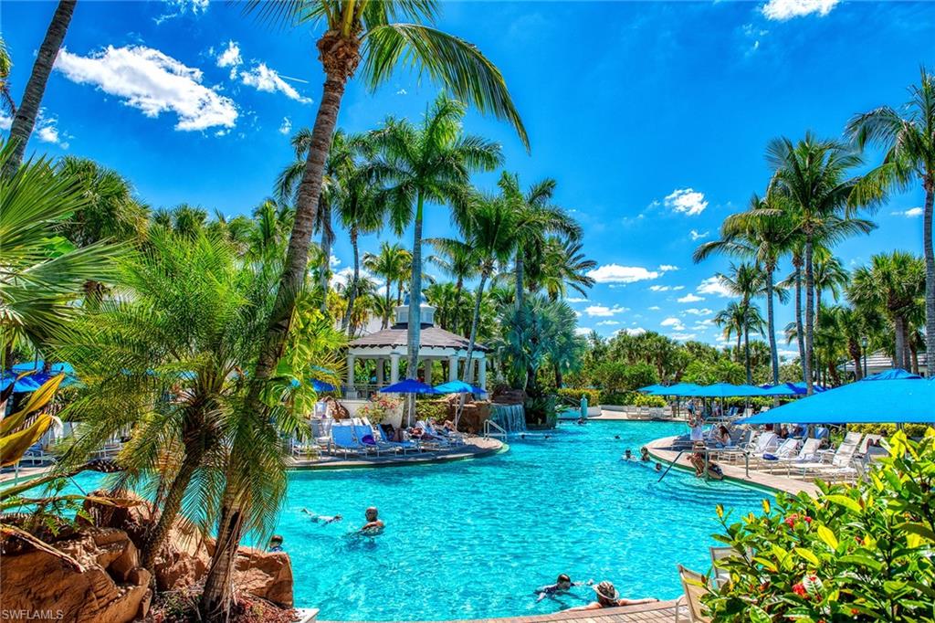 Club and Spa 1st pool .  The pool deck to the right is the front porch of the GATOR GRILL, a Key West Vibe bar and grill where you can have a meal or  you have the Option for Drinks and Meals Poolside... YOUR CHOICE!