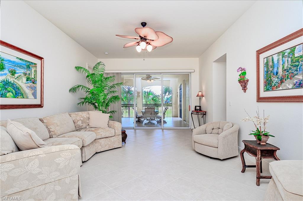Living Room with sliding doors that open to the screened Lanai