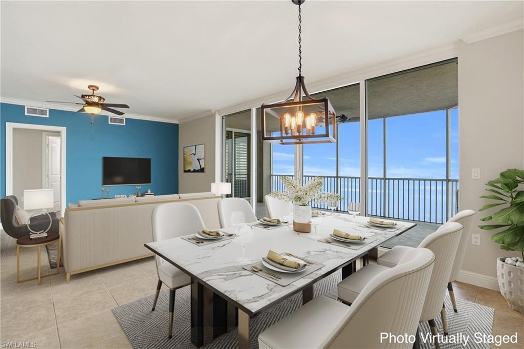 Virtually Staged Dining/Living area with floor to ceiling windows, a ceiling fan, crown molding, a chandelier, and light tile floors