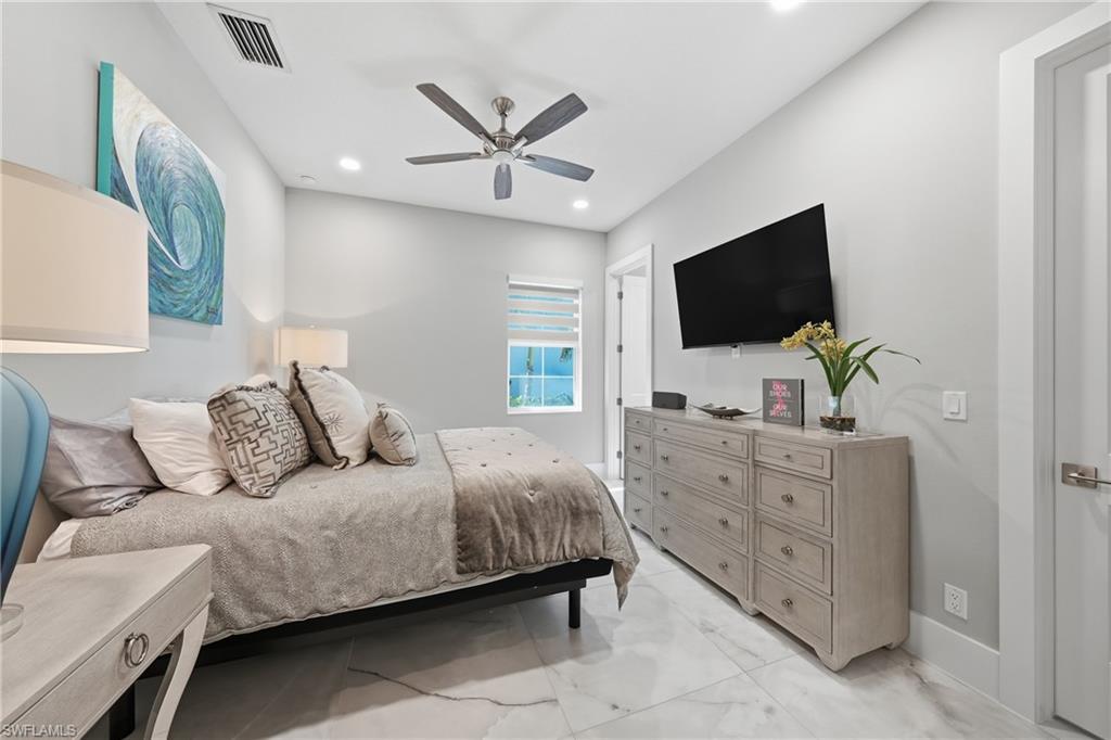Generously sized guest bedroom with ample closet space and privacy, ideal for visiting family or long term stays.