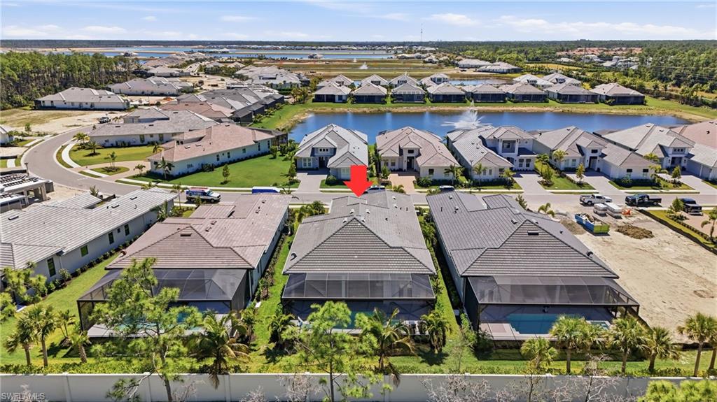 Bird’s eye perspective showcasing the home’s footprint and surrounding green space.