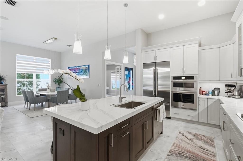 Central gathering island with pendant lighting and generous prep space.