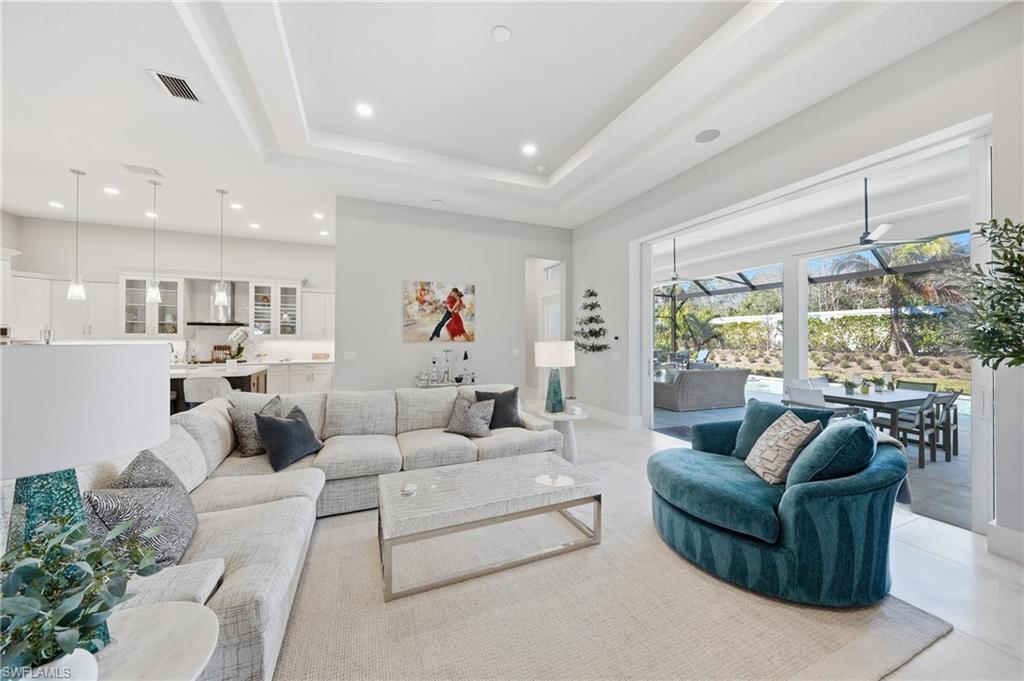 Spacious gathering room with volume ceilings and expansive glass that brings the outdoors in.