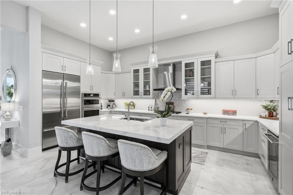 Expansive island kitchen offering seating for guests and effortless flow into the main living area.