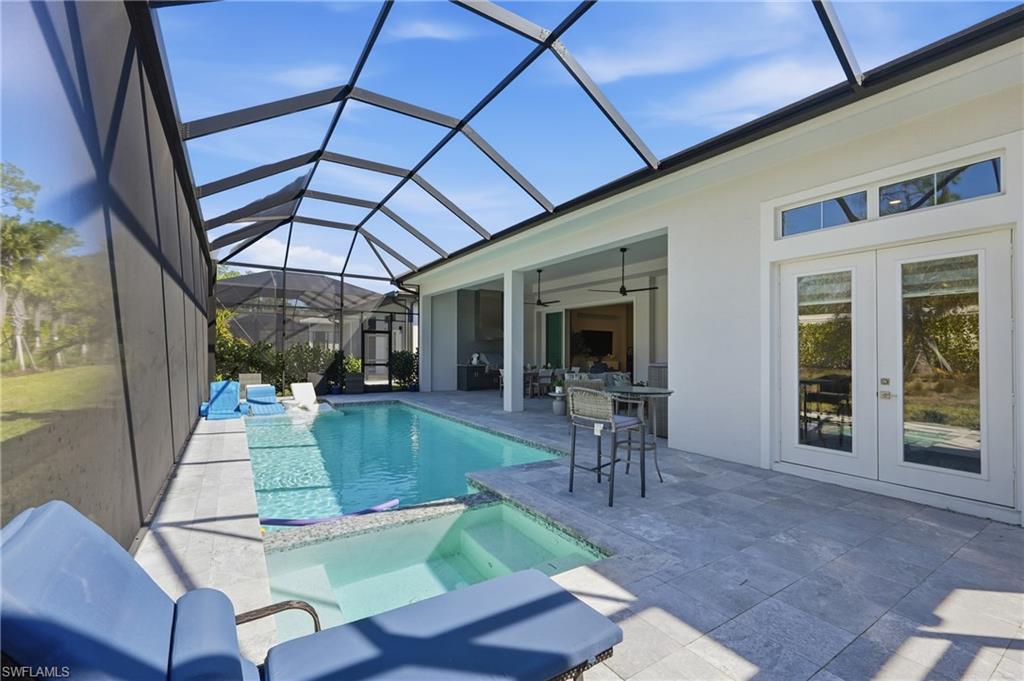 Seamless indoor outdoor living with pocketing sliders opening to nearly 600 square feet of covered lanai.