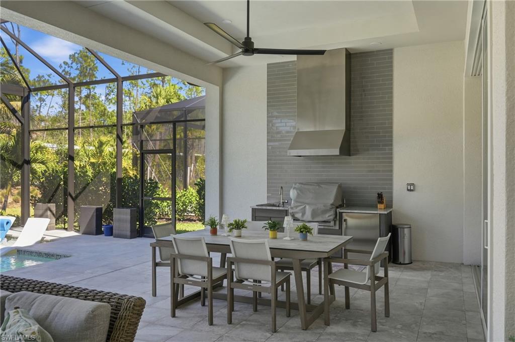 Outdoor kitchen and covered lanai designed for effortless entertaining year round.