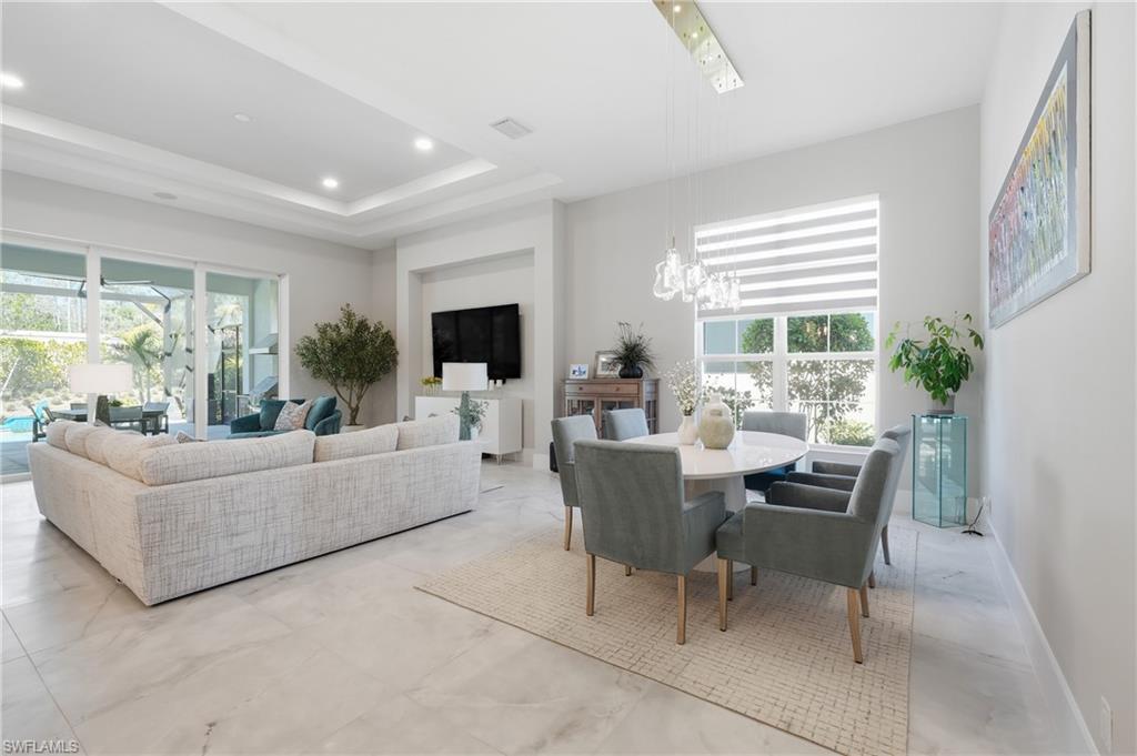 Elegant great room designed for both entertaining and everyday comfort with preserve views beyond.
